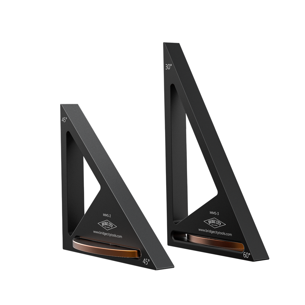 Two black triangular rulers MMS-KIt with brown measurement markings on a white background