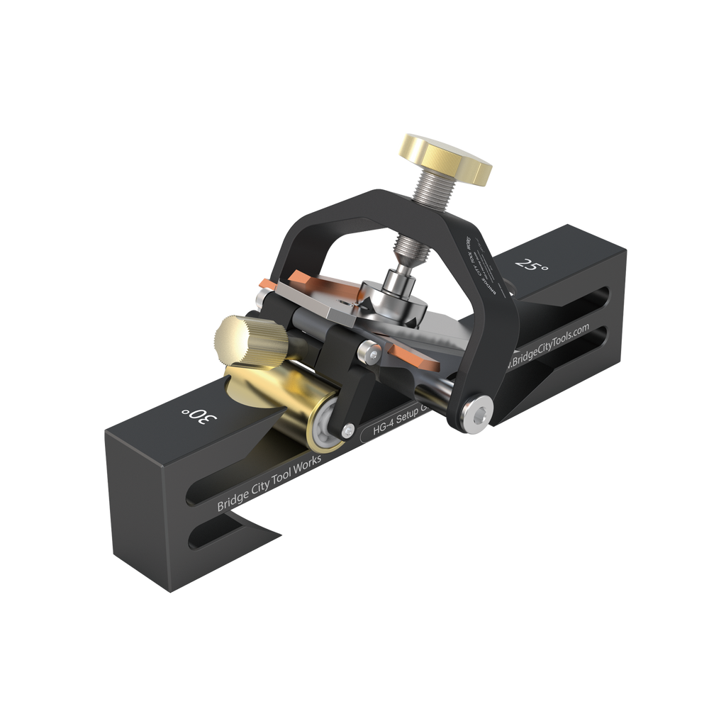 A black HG-4 Honing Guide designed for sharpening irons and chisels, featuring a built-in T-square and adjustment knob.