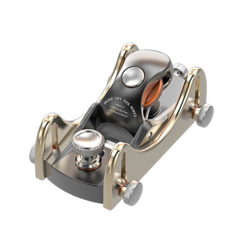 Metallic tool with gold and silver accents on a white background