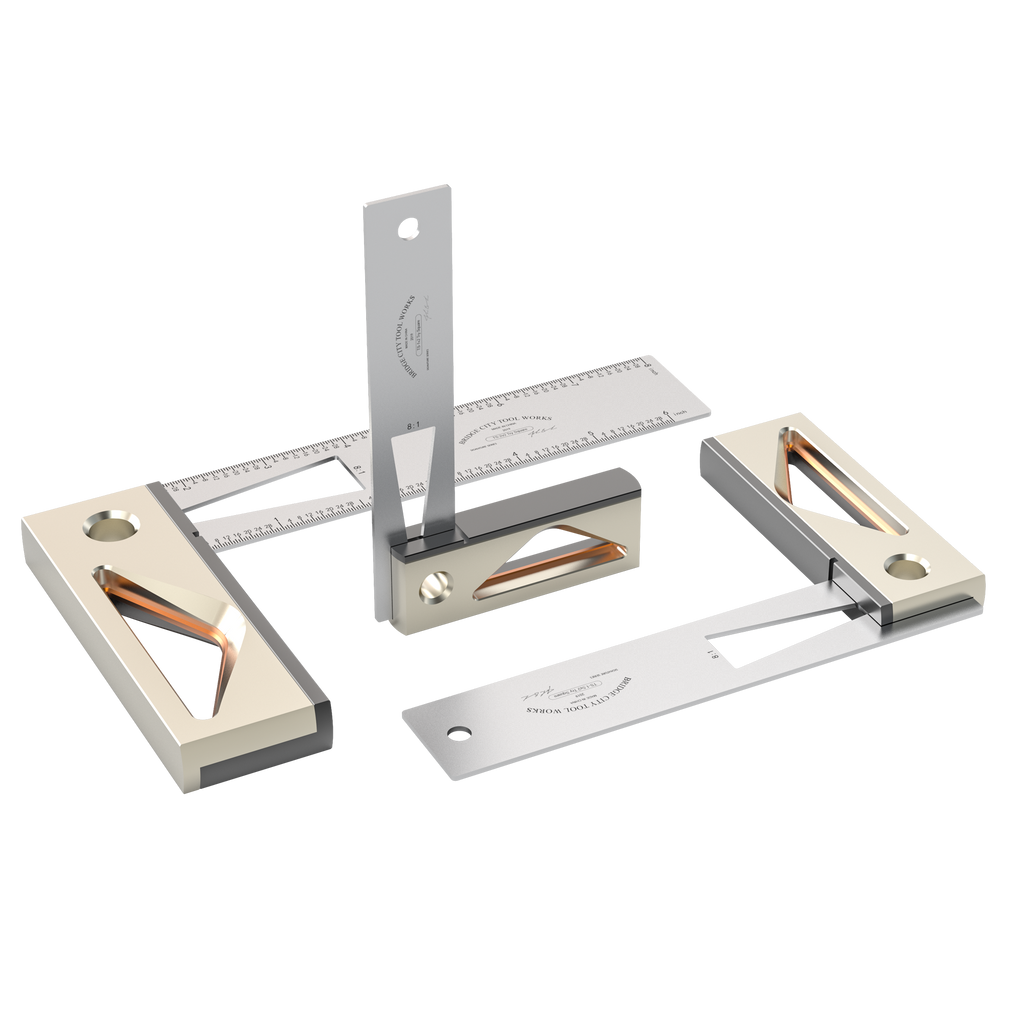 A set of three try squares with stainless steel blades and anodized aluminum handles, displayed on a white background.