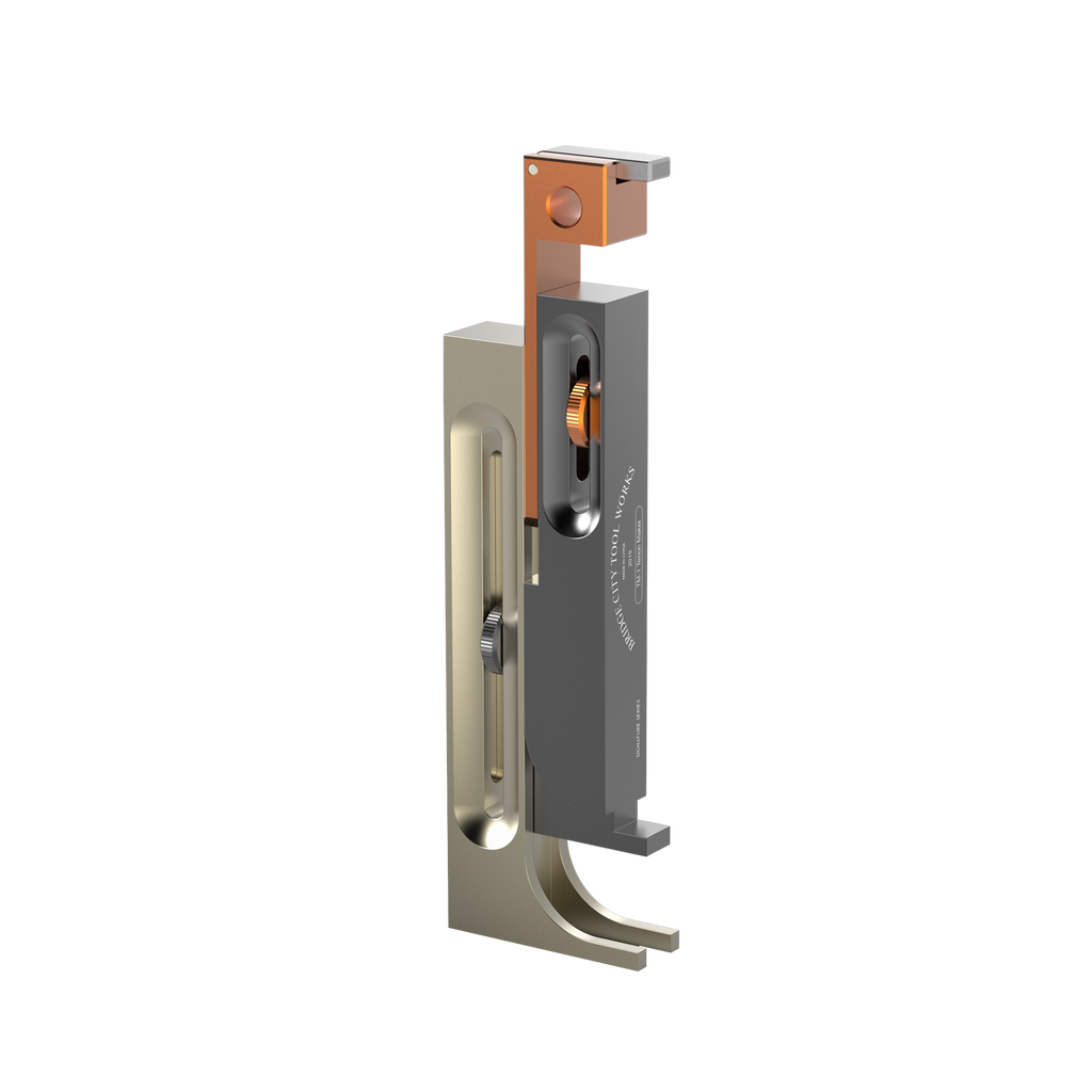 A digital rendering of the TM-1 Tenonmaker, a woodworking tool consisting of one block, two sliders, and two locking knobs, primarily in gray and orange colors.