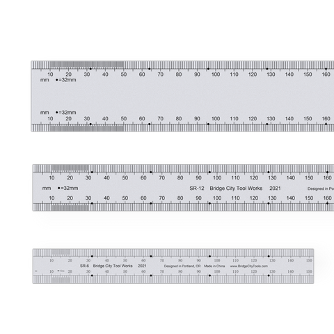 A set of three stainless steel SR series bench rules of different sizes, with laser-etched graduations 