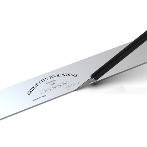 A close-up image of a 24 inch straight edge tool with a reflective silver surface and black text branding.