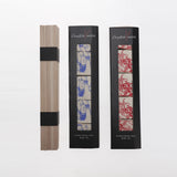 a set of chopsticks with two boxes of sleeves
