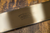 A JS-6 Crosscut Saw with a silver blade