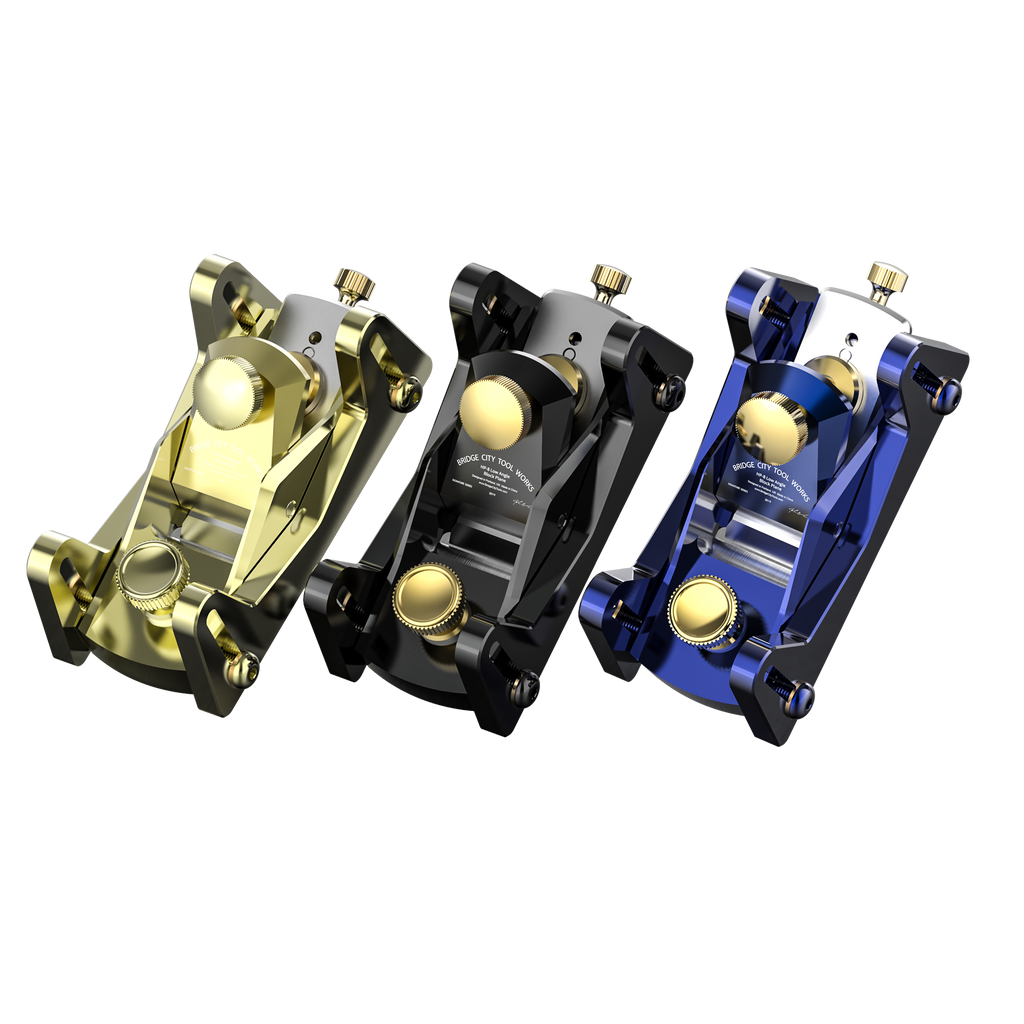 Three HP-8X Celebration Edition Mini Block Planes arranged side by side with different color finishes: black, blue, and gold.