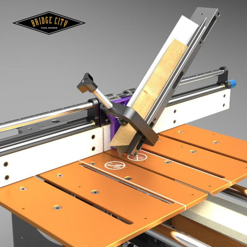 A black anodized aluminum bias arm use with a precision fence system on a n orange table top