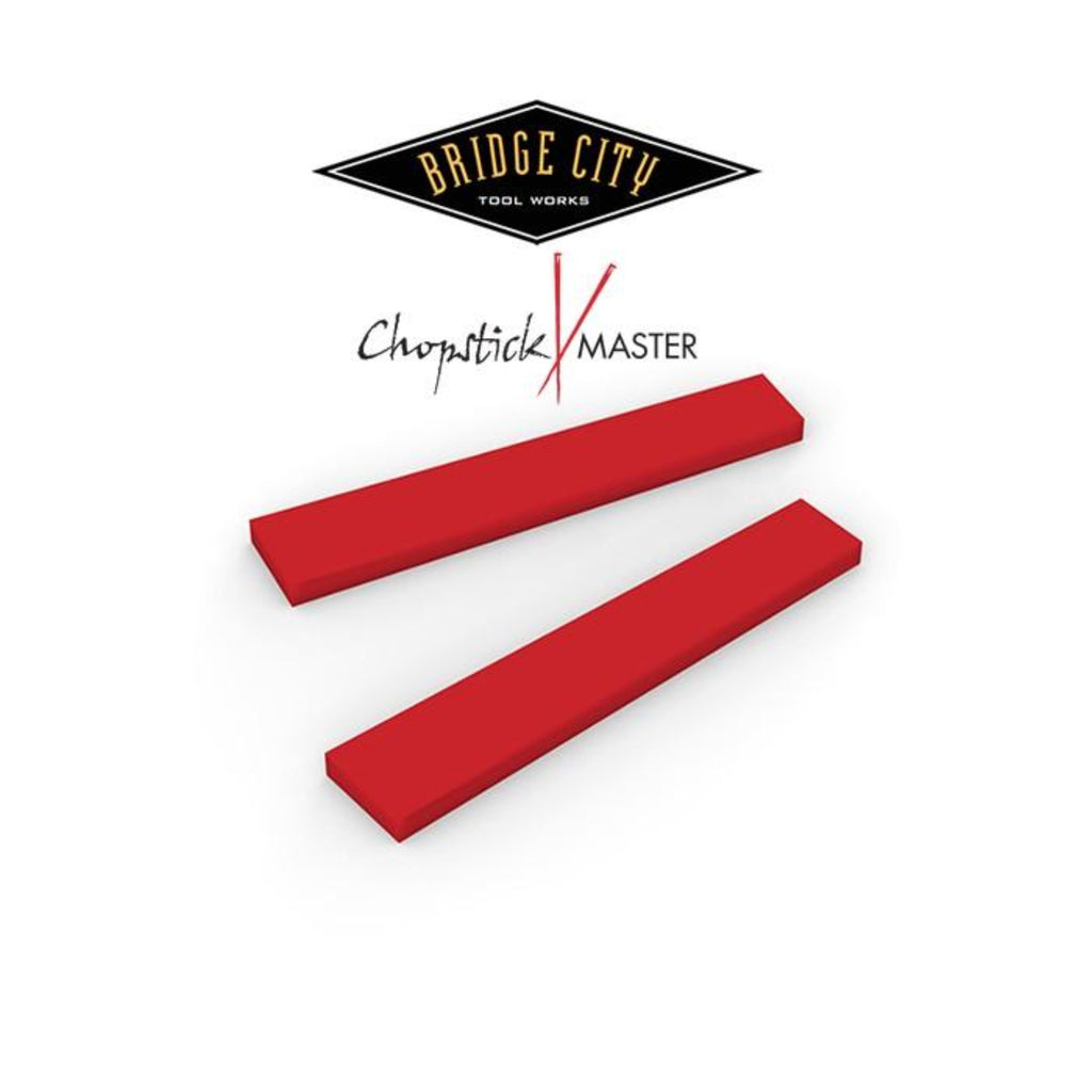 Two red tapered wedges with the 'Bridge City Tool Works' logo and 'Chopstick Master' text overlayed on top.