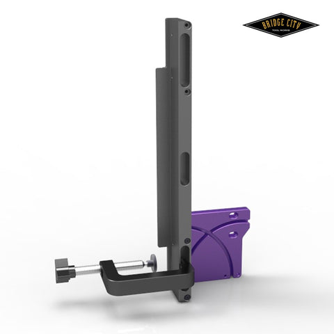 A digital rendering of a tenon miter jig, predominantly gray and purple in color, designed for use with a precision fence on a table saw.